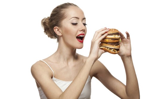 Girl eating hamburger